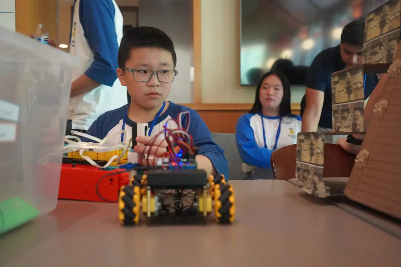 AI Future 1 student with the team robot at AROC