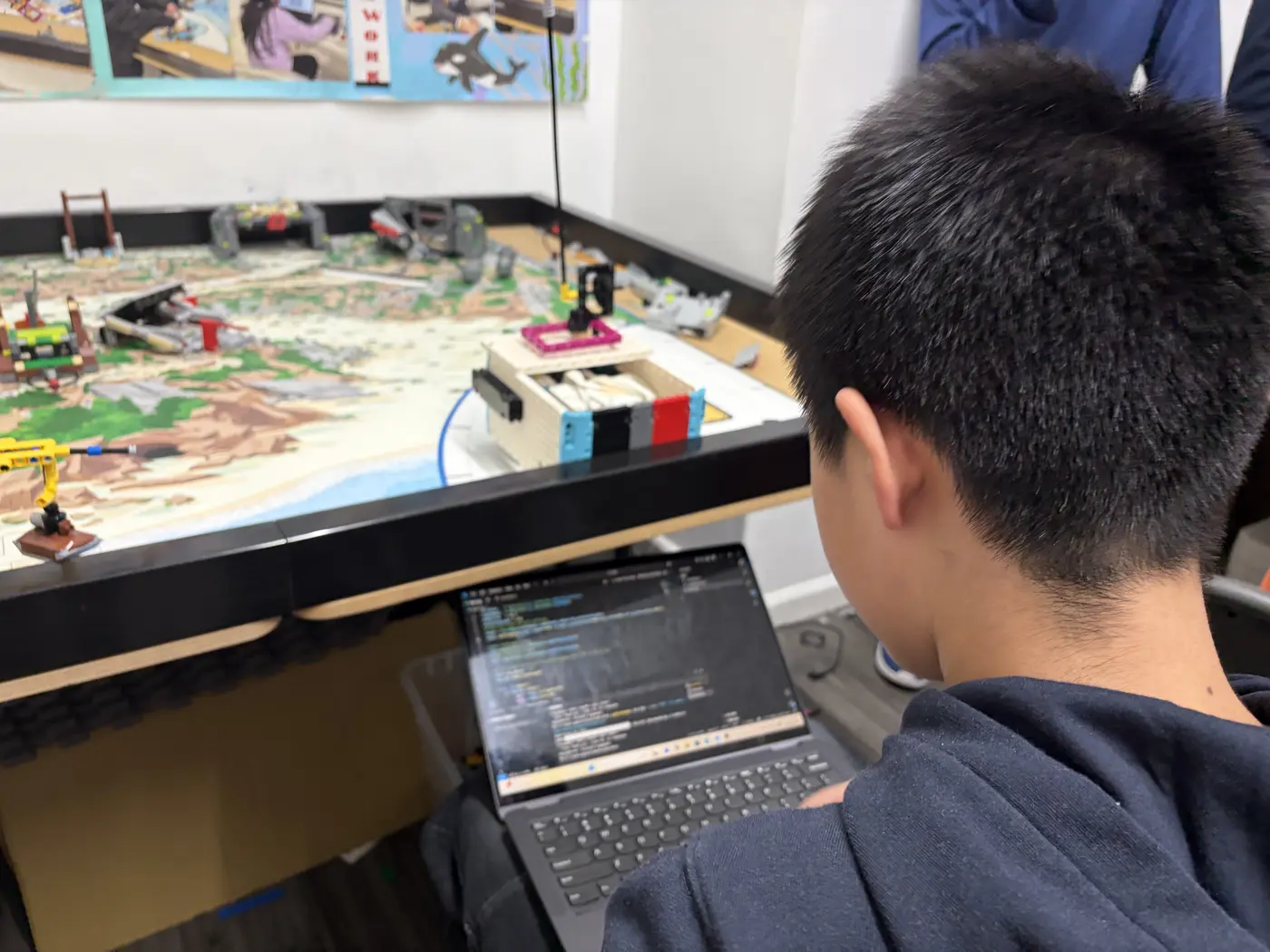 Students learning LEGO SPIKE Robotics