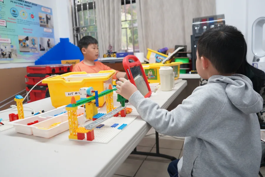 AI Future student building a robotics project during camp